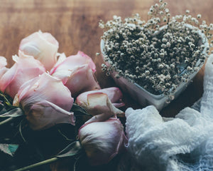 The cover image for the Romance Collection. Featuring pink roses and little white flowers sitting in a heart-shaped bowl.