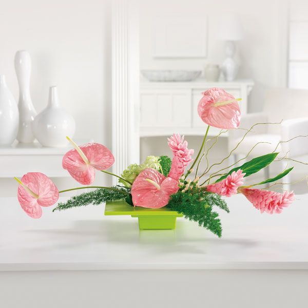  Large pink anthuriums and ginger in a green vase