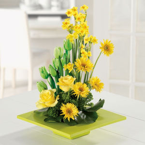 Mother's day bouquet featuring a collection of yellow flowers and greenery