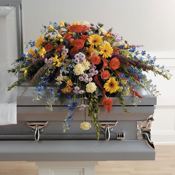 colorful and vibrant casket floral arrangement 